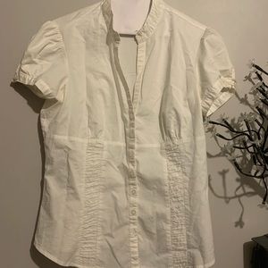 White old styled V-neck blouse.